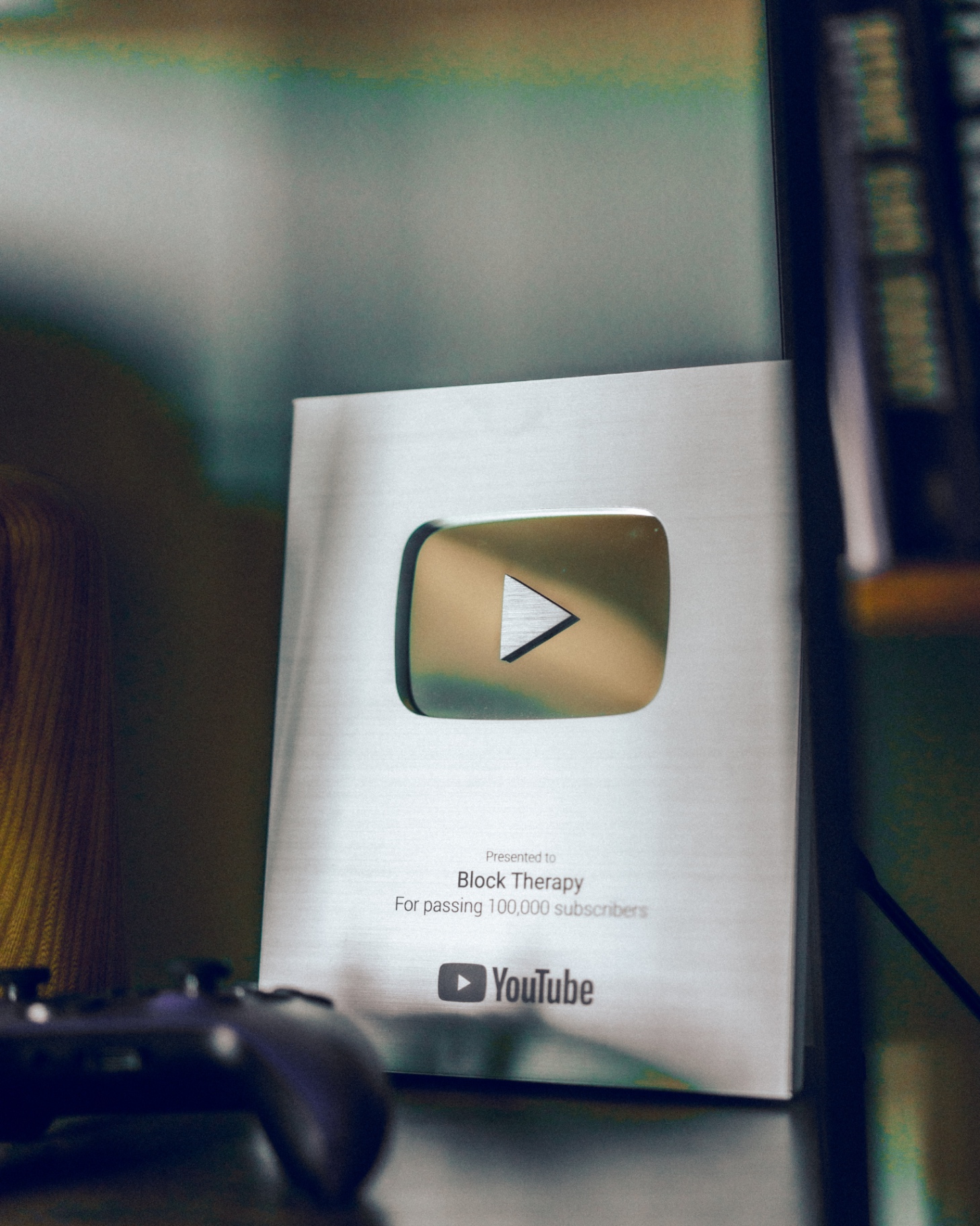 YouTube Silver Creator Award plaque presented to Block Therapy for passing 100,000 subscribers